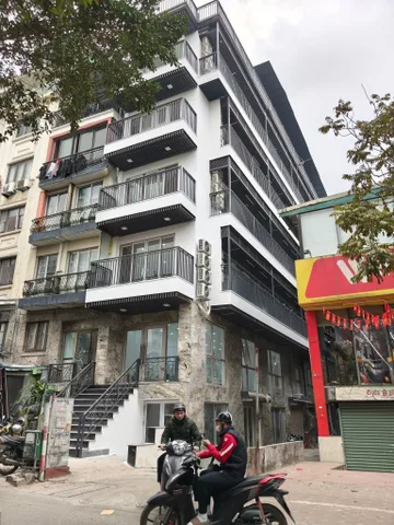 TÒA VĂN PHÒNG TRUNG KÍNH TRẦN DUY HƯNG 200m, 7 TẦNG THANG MÁY,  3 MẶT ĐƯỜNG  Ô TÔ.