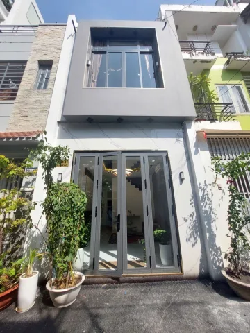 Nhà bán nguyễn văn công 3 tầng, hẽm xe hơi thông, gần sân bay bv 175